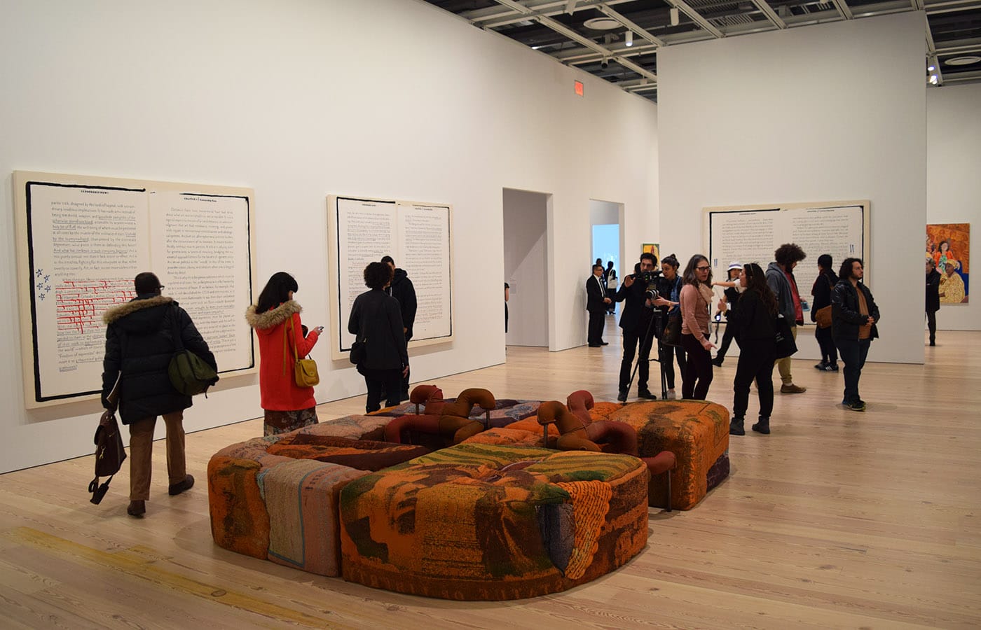 Installation view of the 2017 Whitney Biennial, with paintings by Frances Stark and, at center, Jessi Reaves's "Ottoman with Parked Chairs" (2017)