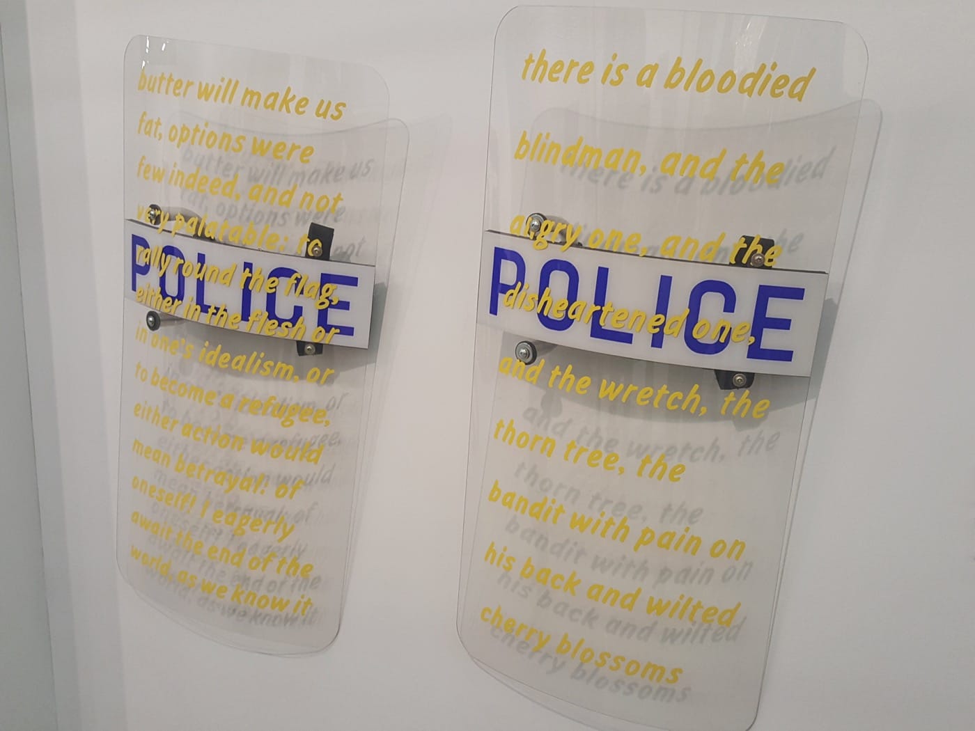 Daniel J. Martinez, “Riot Shield (Butter)” (2012) and “Riot Shield (Cherry Blossom)” (2012), in the Roberts &amp; Tilton booth