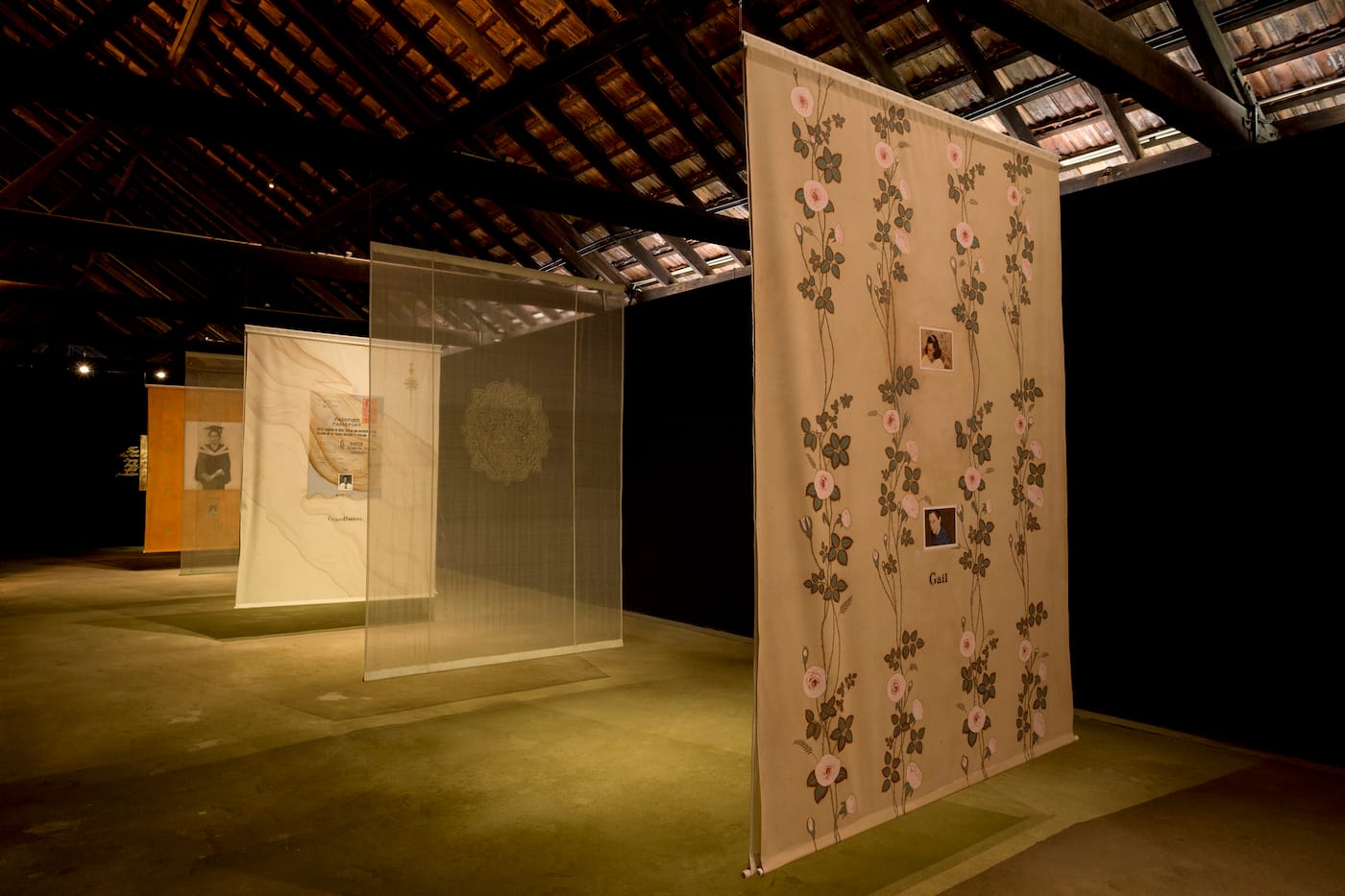 Desmond Lazaro, "Family Portraits" (2016), installation with hanging cloth, small paintings, video (5:07 minutes), icon with gilded gold leaf