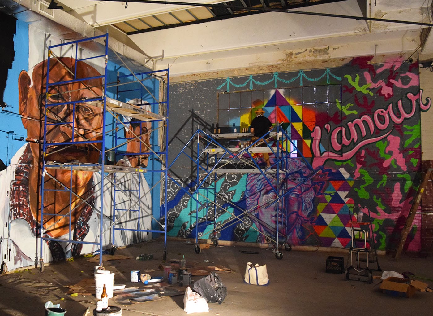 Murals in progress by NDA (left) and L'Amour Supreme (right) at Market Surplus