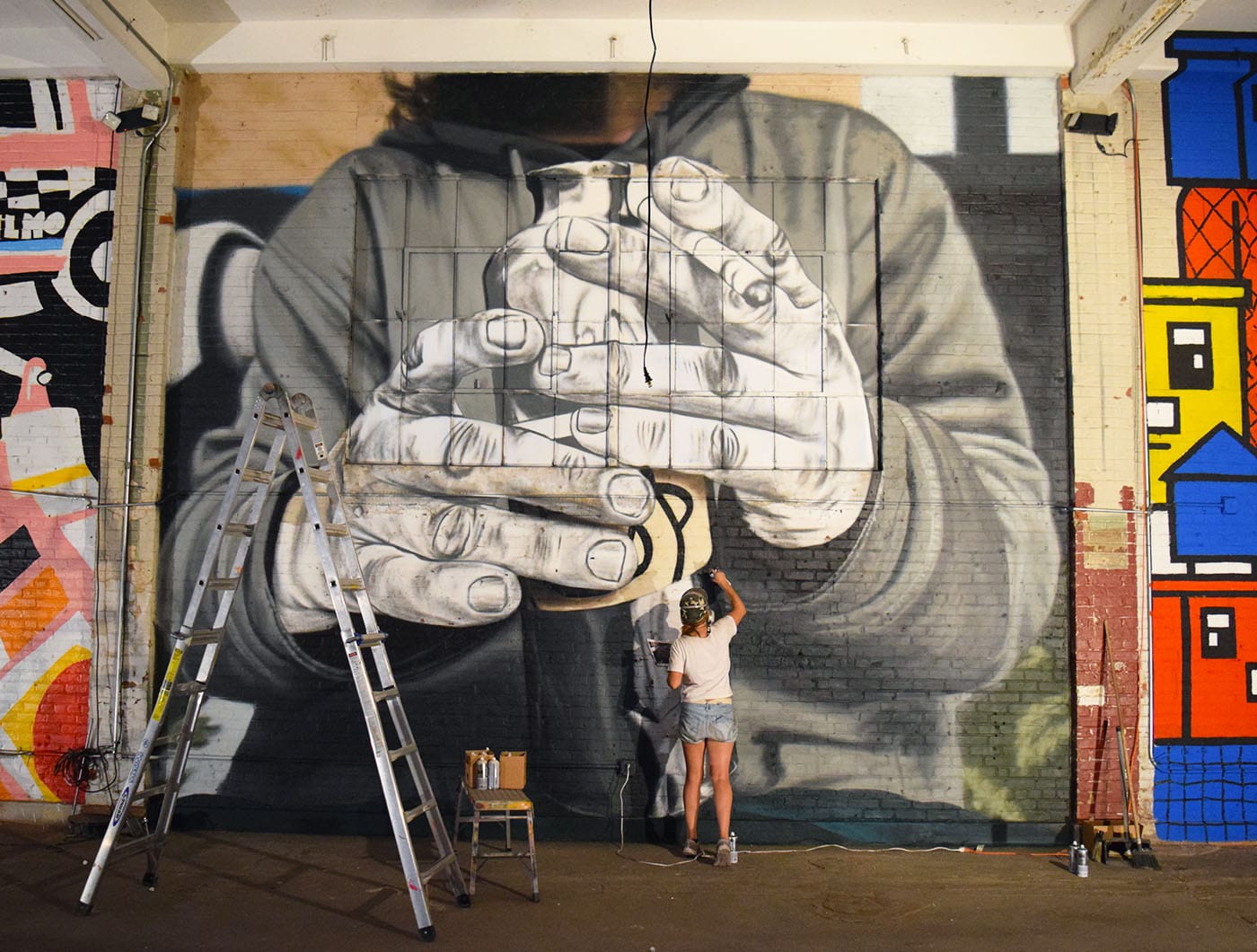 BKFOXX mural in progress at Market Surplus