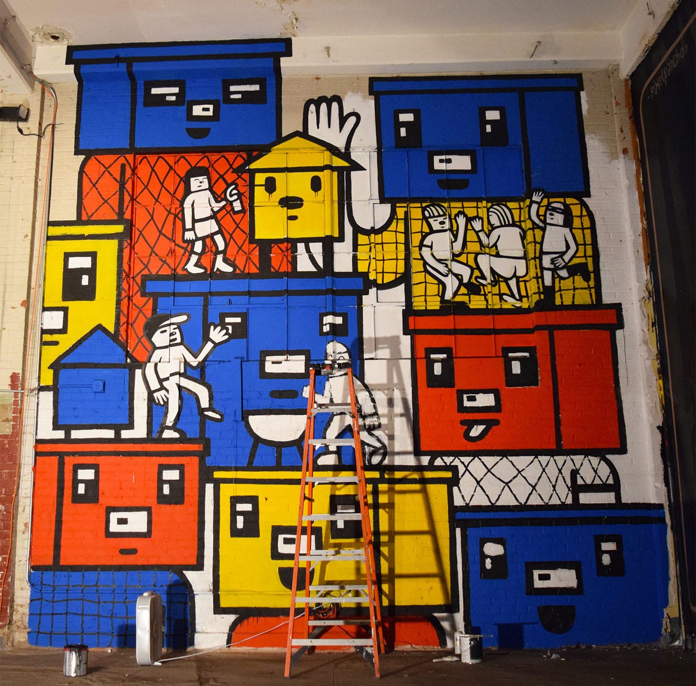 A mural in progress by Sonni at Market Surplus