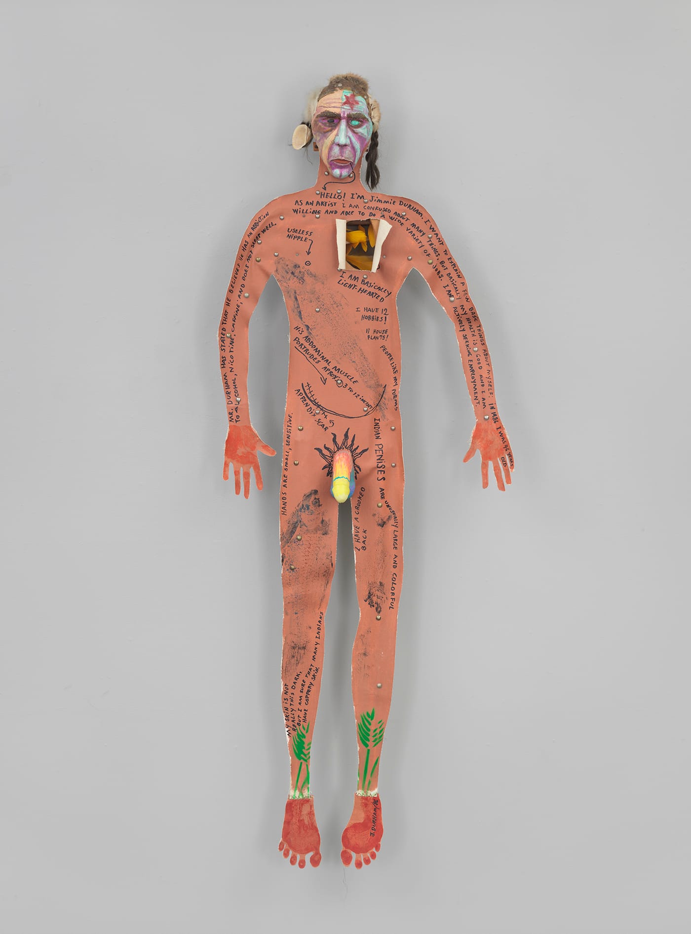 Jimmie Durham, "Self-portrait" (1986), canvas, cedar, acrylic paint, metal, synthetic hair, scrap fur, dyed chicken feathers, human rib bones, sheep bones, seashell, thread, 78 x 30 x 9 in, Whitney Museum of American Art, New York (photo ©Whitney Museum)