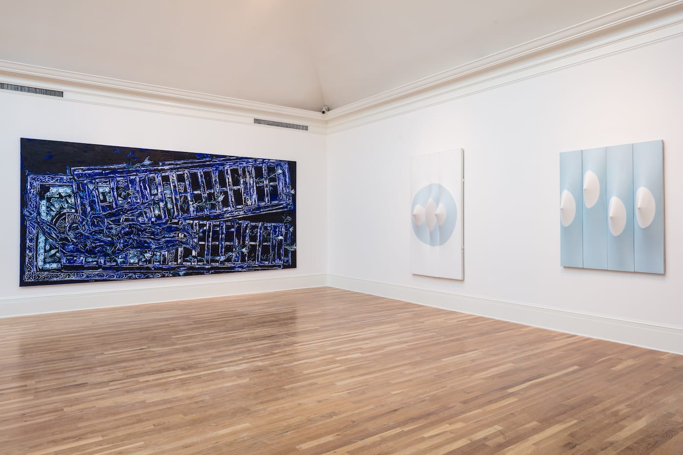 Installation view of Beyond the Canvas: Contemporary Art from Puerto Rico at the Newcomb Art Museum with works by Arnaldo Roche-Rabell (left) and Zilia Sánchez (right)