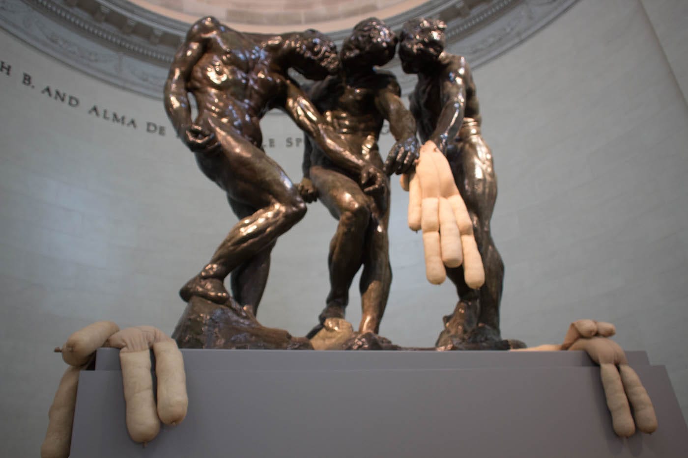 “Tit Teddy” (2017) by Sarah Lucas in the grip of “Three Shades” (1898) by Auguste Rodin