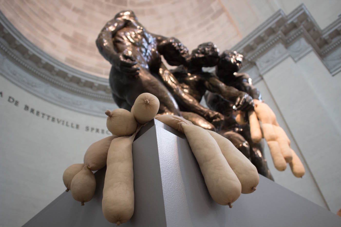 “Tit Teddy” (2017) by Sarah Lucas in the grip of “Three Shades” (1898) by Auguste Rodin