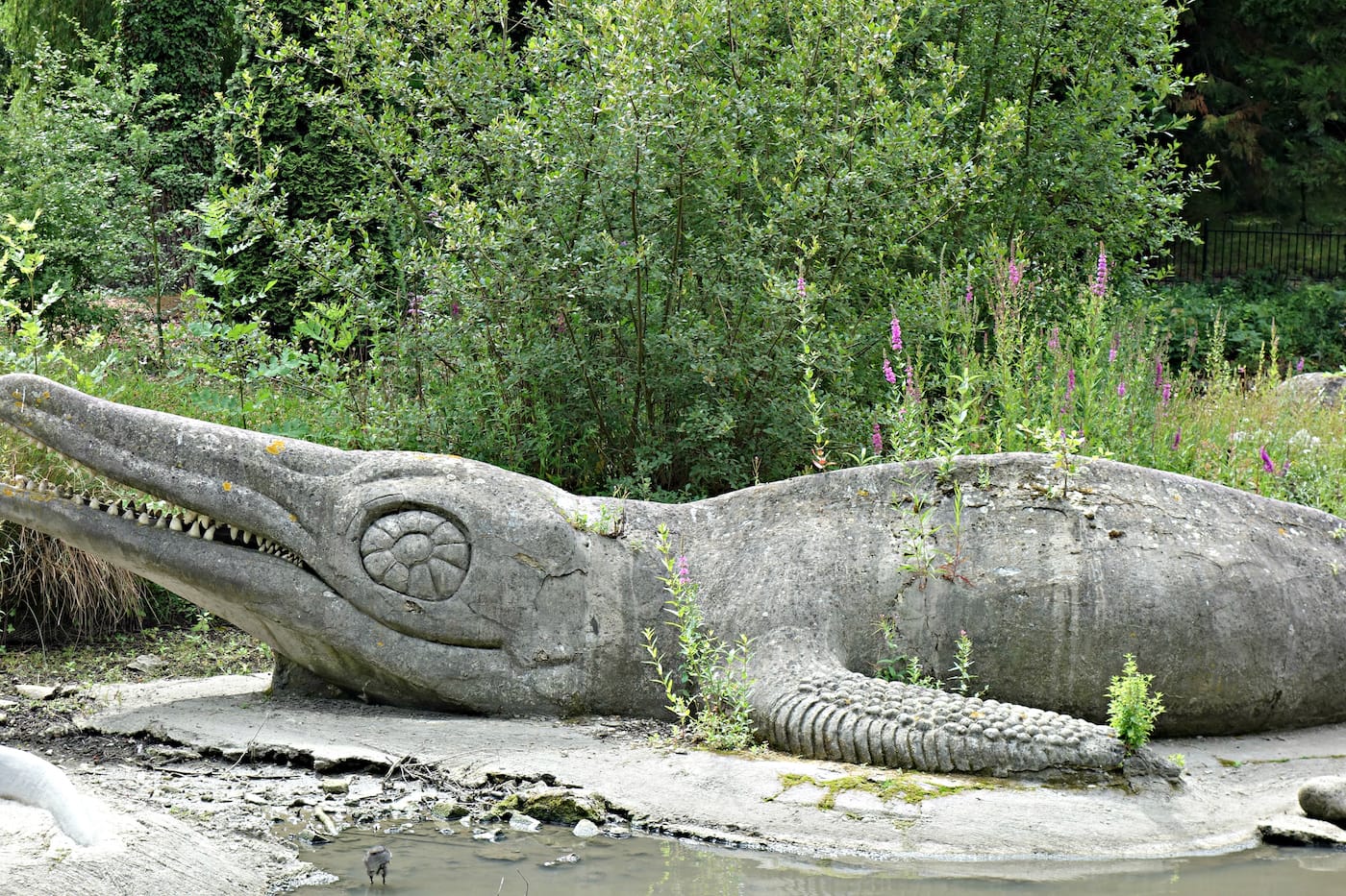 Dinosaur sculptures in Crystal Palace Park, London (photo by the author for Hyperallergic)