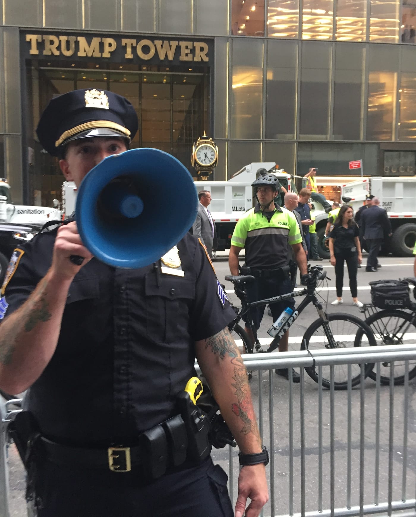 NYPD officers shepherding crowds of protesters outside Trump Tower on August 14