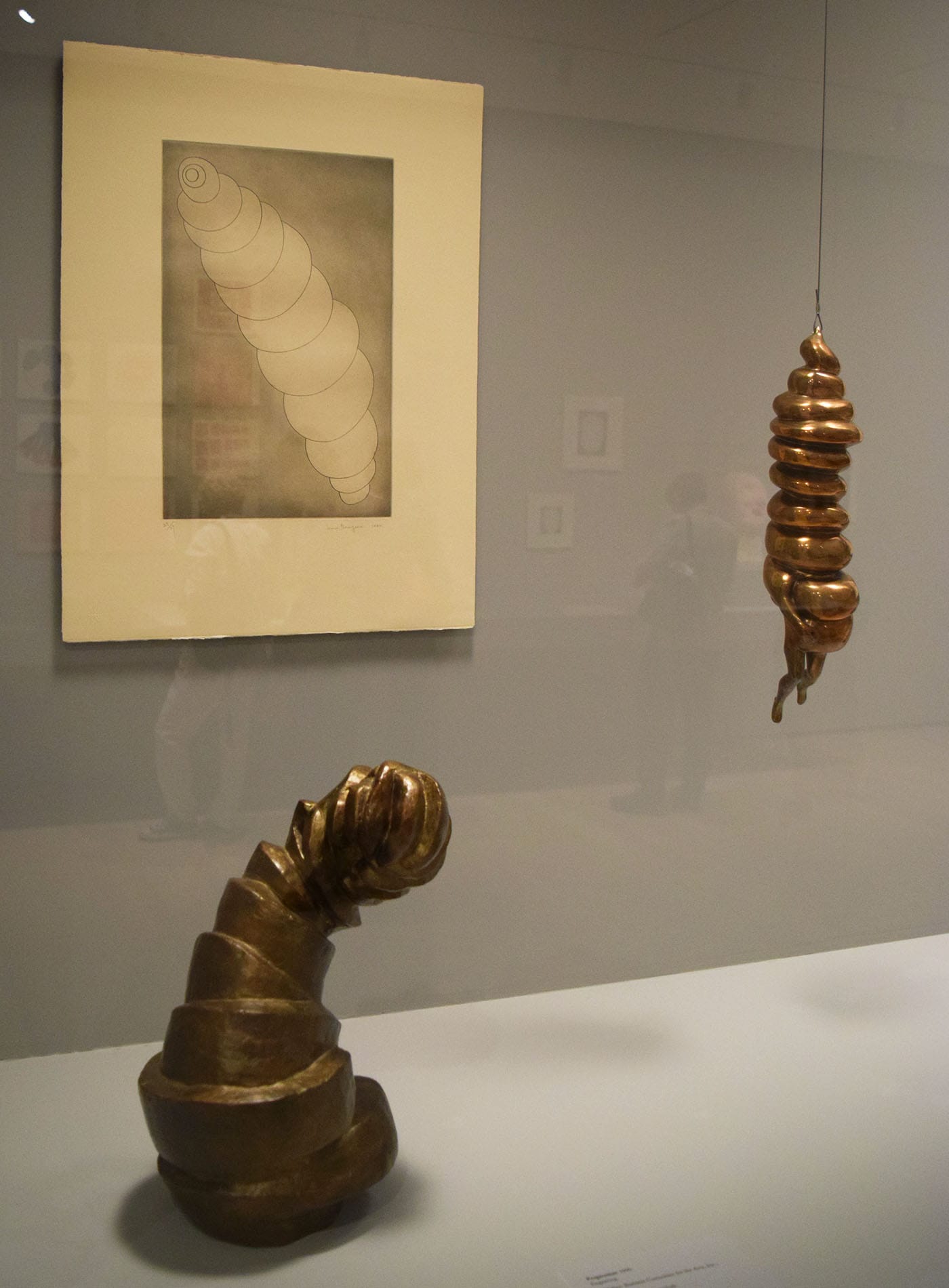 Installation view of Louise Bourgeois: An Unfolding Portrait at the Museum of Modern Art featuring a case of spiral-themed works