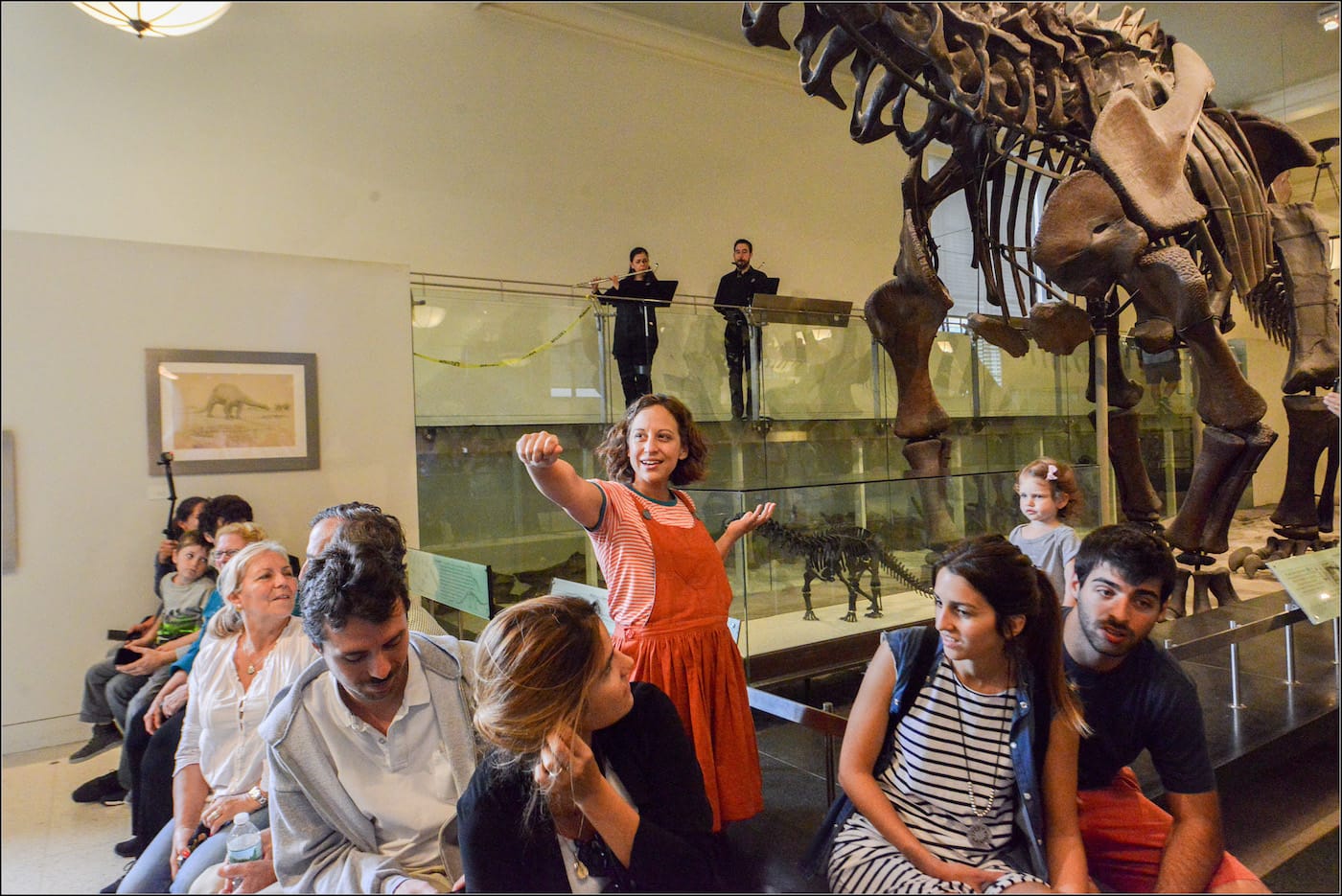 <em>Rhoda and the Fossil Hunt</em> in the Hall of Saurischian Dinosaurs at the American Museum of Natural History (photo by Shervin Lainez)