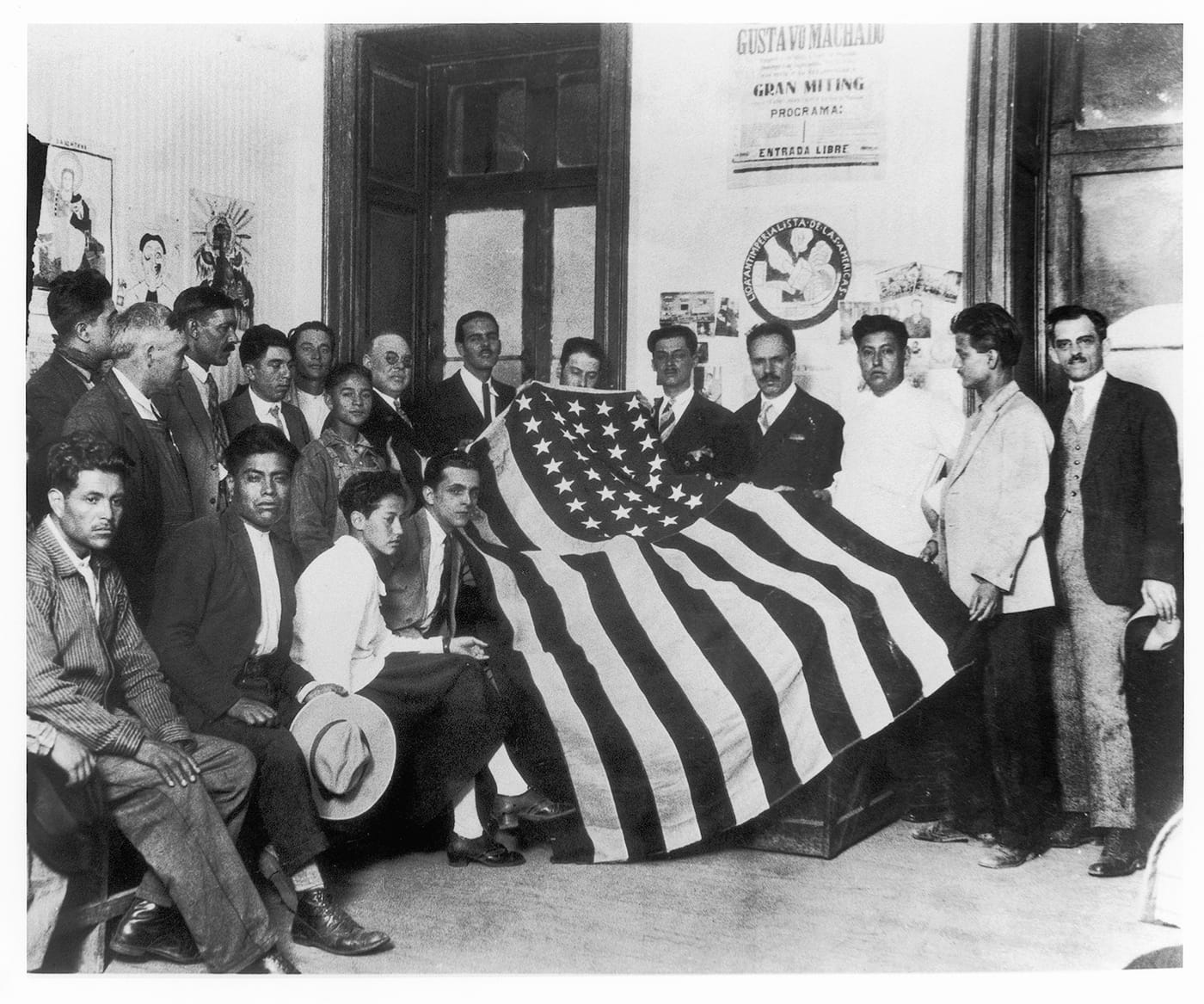 Tina Modotti, "The Hands Off Nicaragua Committee with the American Flag Captured by Sandino" (1928) (courtesy La Fábrica)