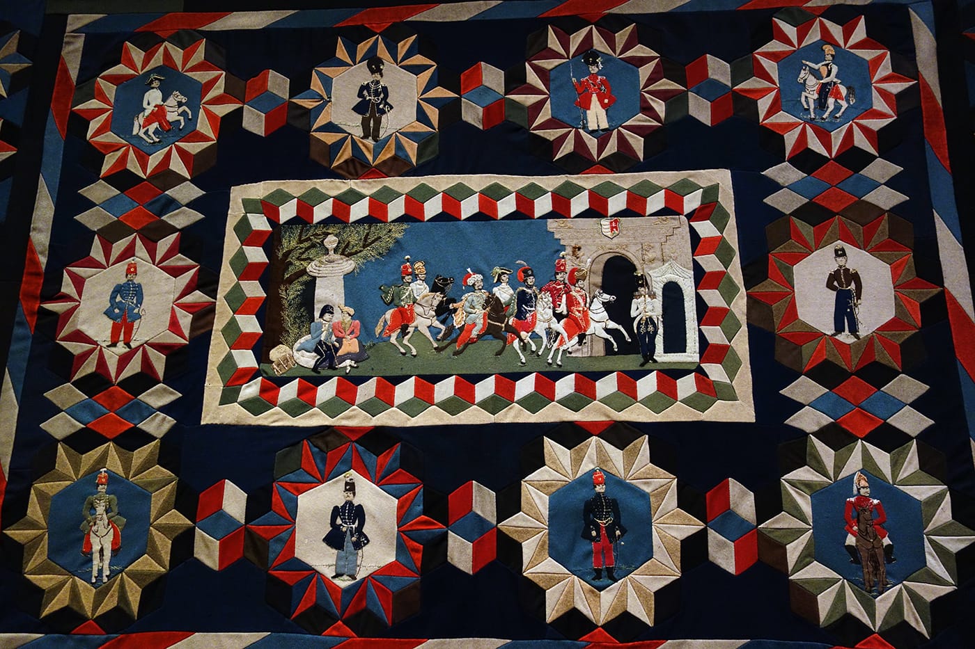 Hungarian Soldier’s Intarsia Quilt by an unidentified artist (Austro-Hungarian Empire, 1820–30), wool, with embroidery thread; inlaid; hand-appliquéd and hand-embroidered (photo by the author for Hyperallergic)