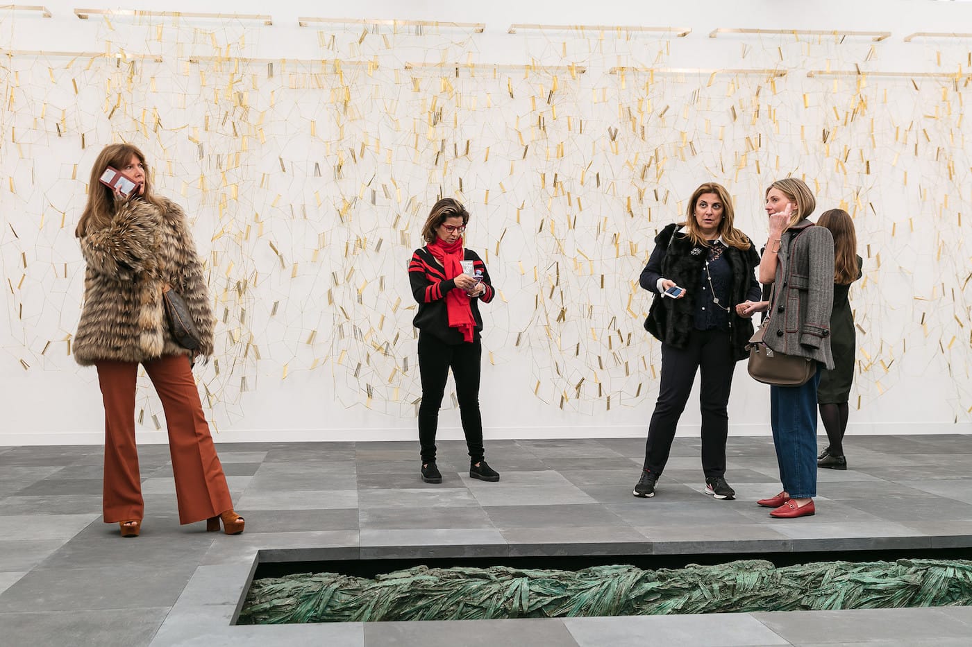 Installation view of Marian Goodman's booth at Frieze London 2017, with Leonor Antunes's bronze curtain sculpture in the background (photo by Mark Blower; courtesy of Mark Blower/Frieze)