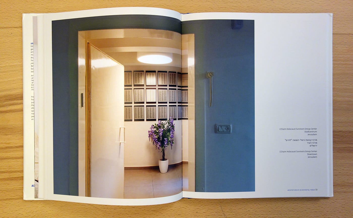 Pages from <em>Architecture of an Existential Threat</em> (photo of the book for Hyperallergic)