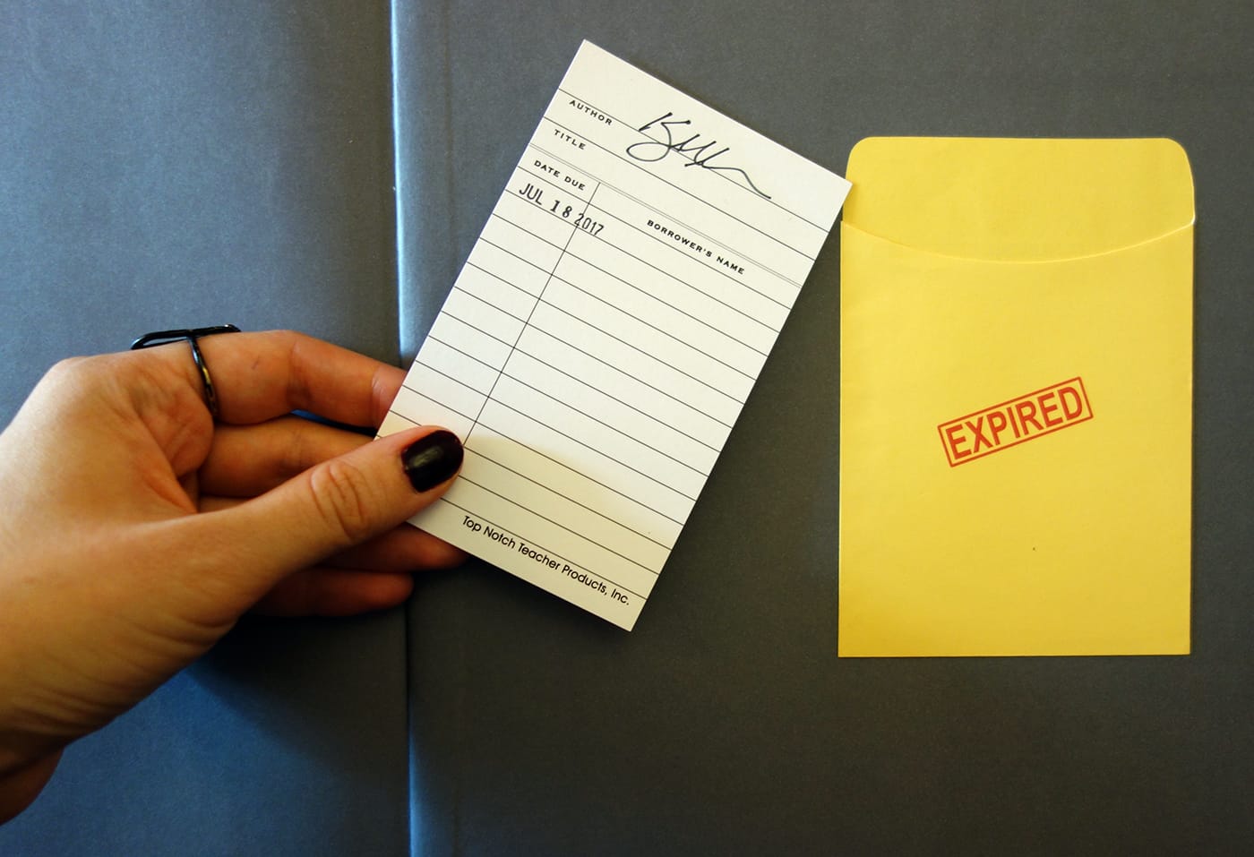 Check-out card in Expired by Kerry Mansfield (photo of the book for Hyperallergic)