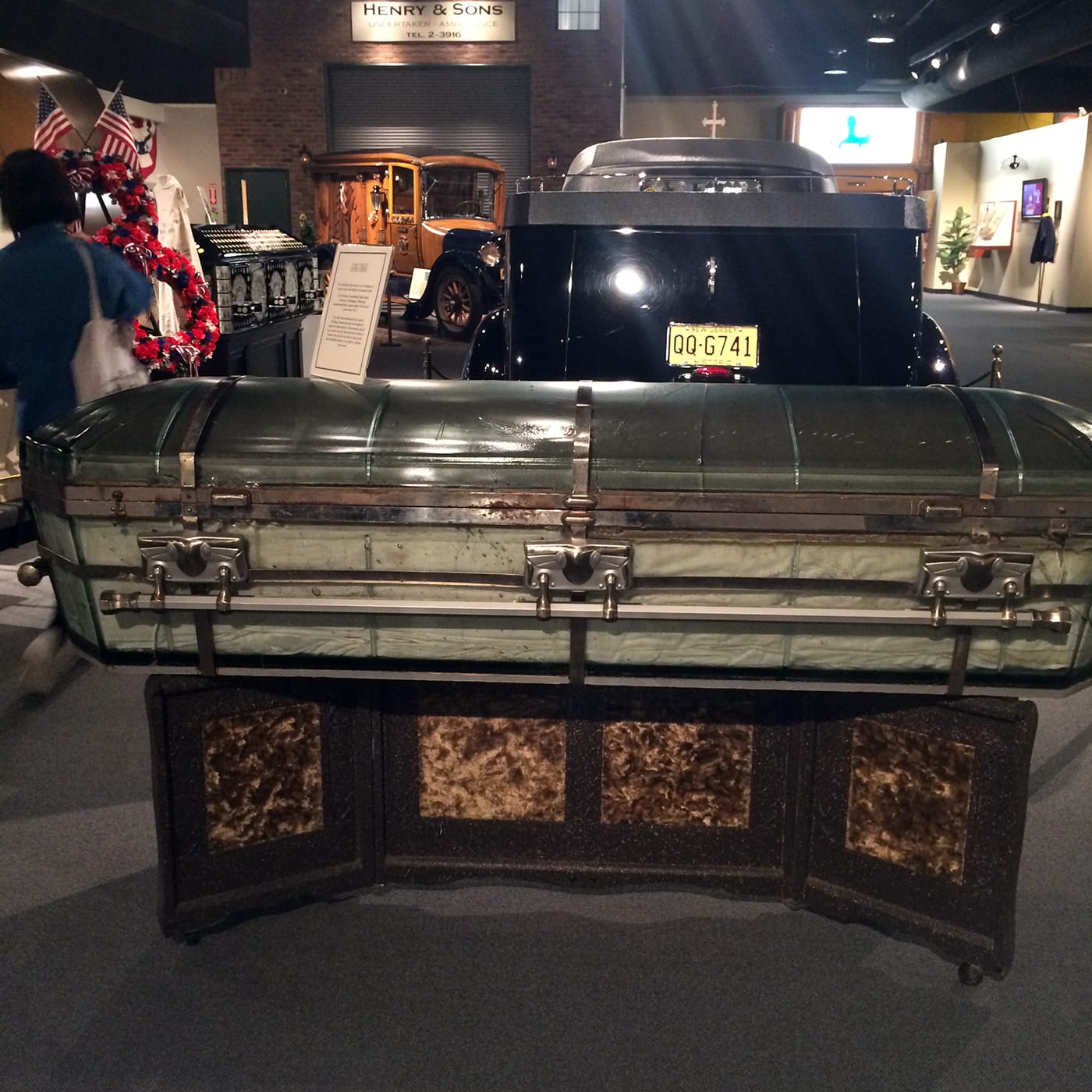 A glass coffin on view at the National Museum of Funeral History (photo by the author for Hyperallergic)