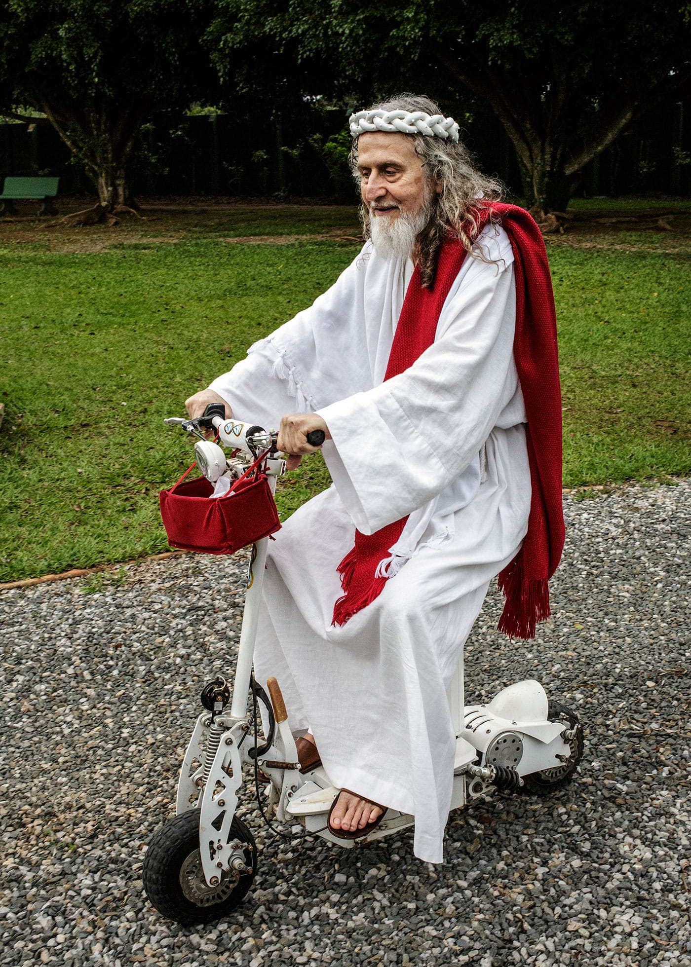 "INRI Cristo rides a bike around his compound outside of Brasilia, known as the New Jerusalem. 'INRI' are the initials that Pontius Pilate had written on top of Jesus's cross." (Brazil, 2014), photograph by Jonas Bendiksen from <em>The Last Testament</em> (courtesy Aperture, © Jonas Bendiksen/Magnum Photos)