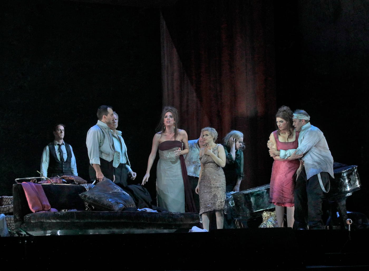 Christian Van Horn as Julio, David Adam Moore as Col. Álvaro Gómez, Rod Gilfry (partially hidden) as Alberto Roc, Audrey Luna as Leticia Maynar, Iestyn Davies (mostly hidden) as Francisco de Ávila, Sally Matthews as Silvia de Ávila, Alice Coote as Leonora Palma, Amanda Echalaz as Lucia de Nobile, and Joseph Kaiser as Edmundo de Nobile in Adès's <em/>The Exterminating Angel (photo by Ken Howard/Metropolitan Opera)