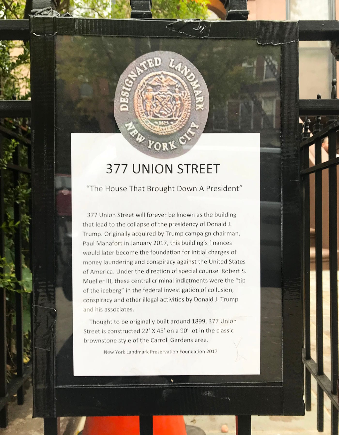 The satirical plaque at the entrance to Paul Manafort's Brooklyn brownstone (click to enlarge)
