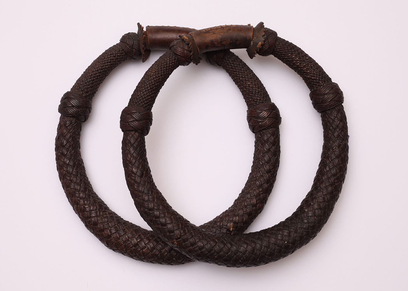 Pair of seaman’s chest beckets (late 19th century), twine, marline, leather, shellac (courtesy New Bedford Whaling Museum)