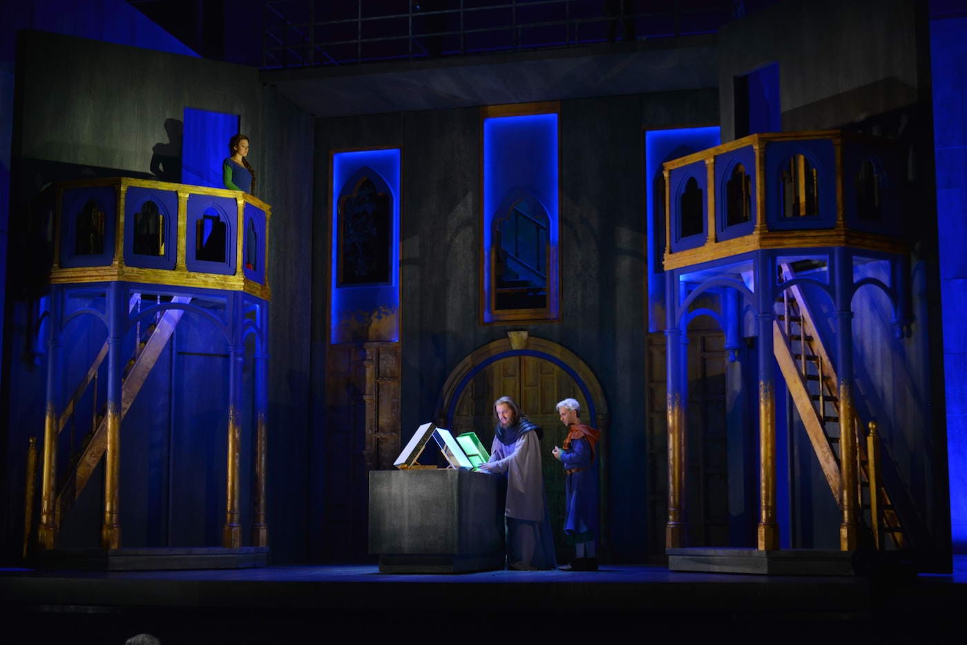 The Boy (countertenor Anthony Roth Costanzo) shows the completed pages of the book to the Protector (baritone Mark Stone), in a scene from Written on Skin at Opera Philadelphia.