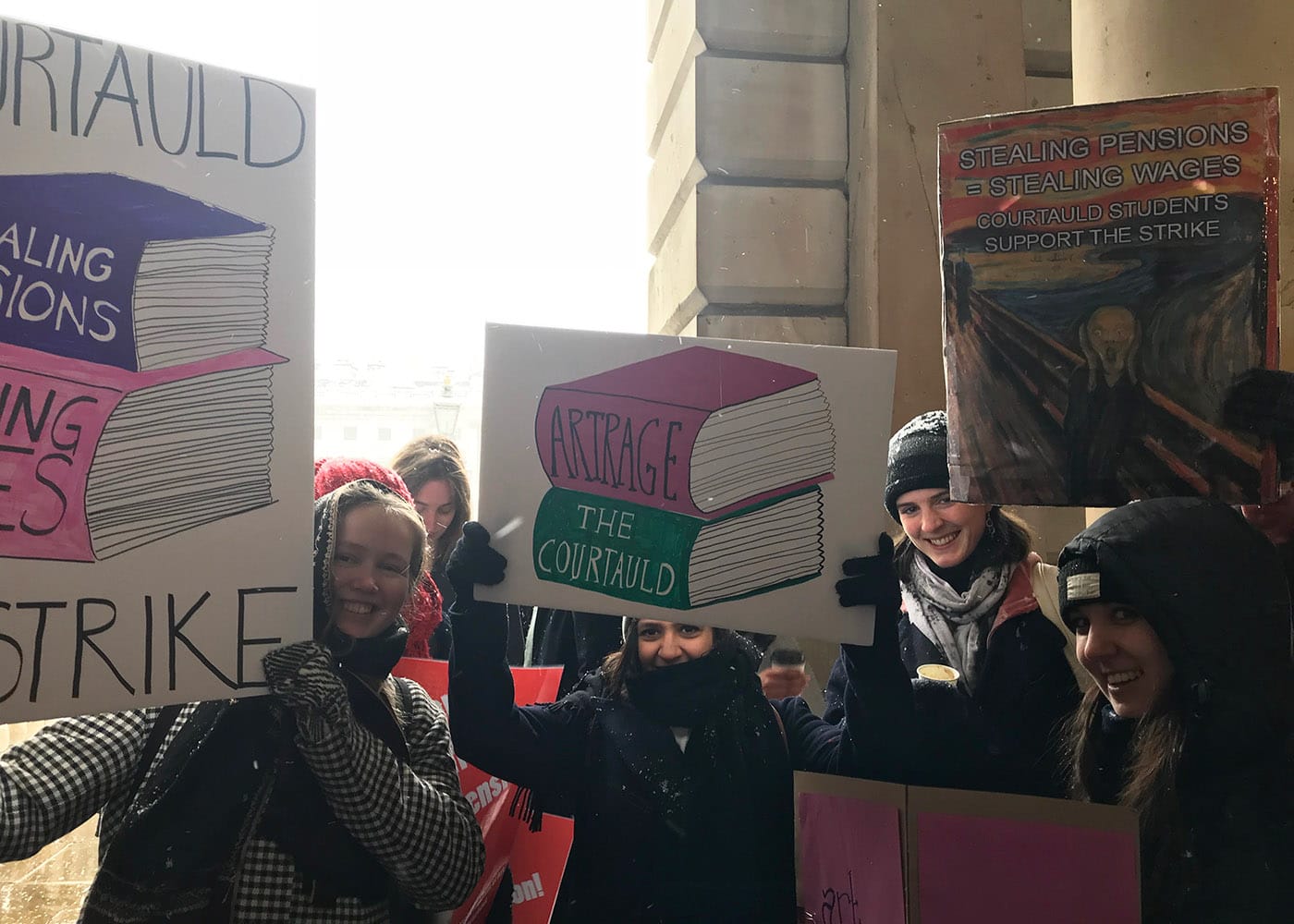 Art students and faculty with placards in support of the University and College Union strike