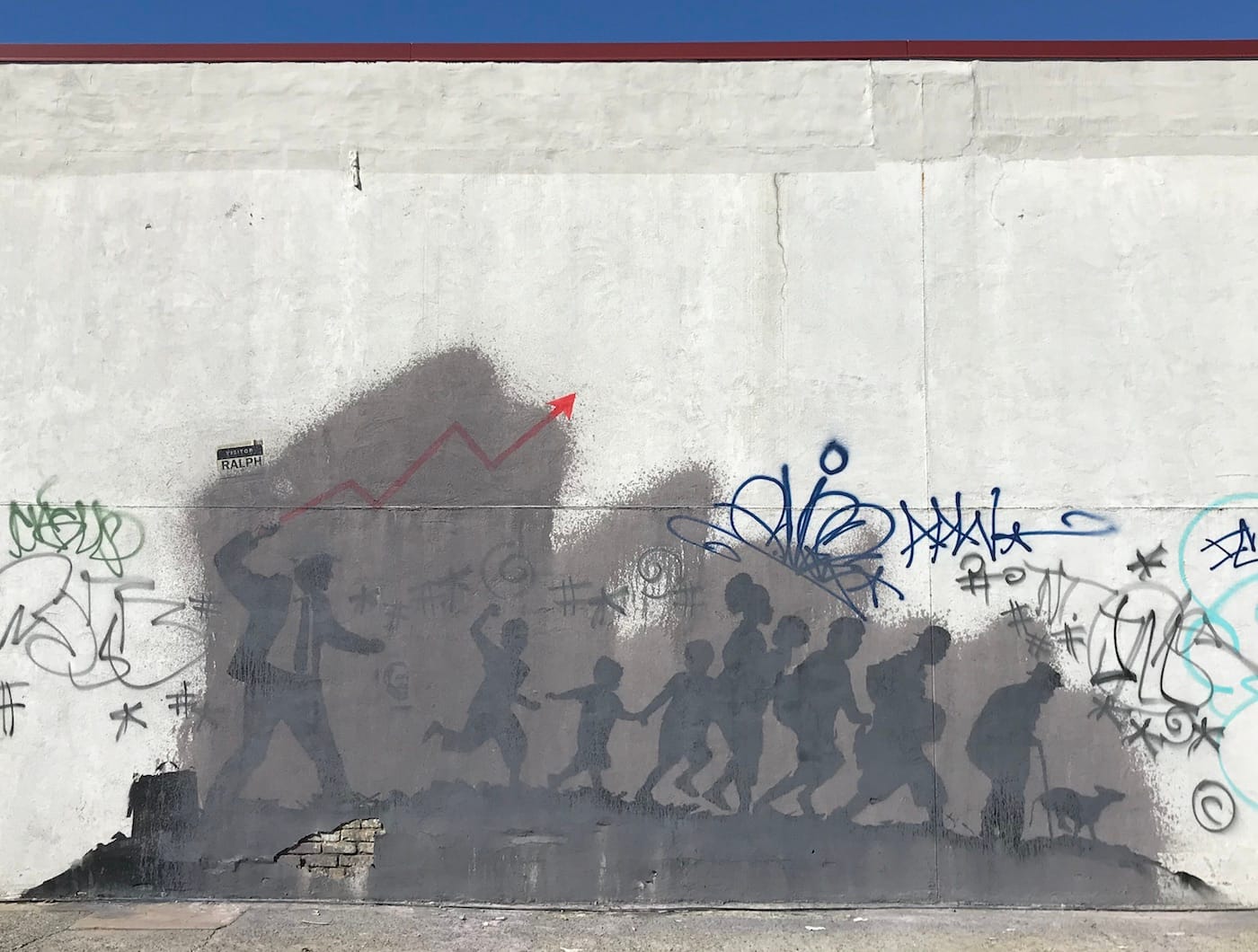 The larger of Banksy's two Midwood murals, partially obscured by gray paint