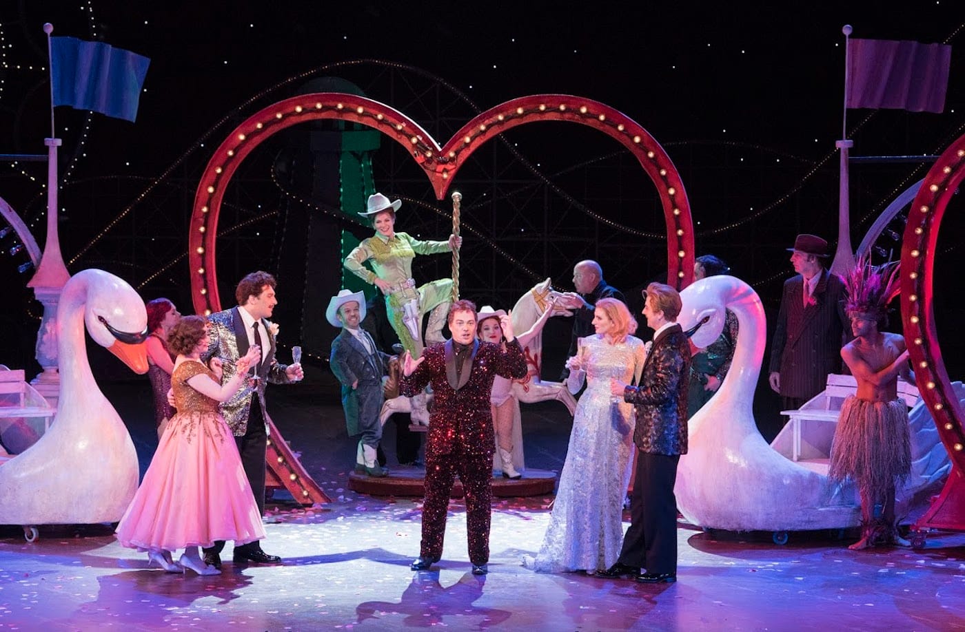 A scene from Act II of Mozart's Così fan tutte with Serena Malfi as Dorabella, Adama Plachetka as Guglielmo, Kelli O'Hara as Despina, Christopher Maltman as Don Alfonso, Amanda Majeski as Fiordiligi, and Ben Bliss as Ferrando (photo by Jonathan Tichler, courtesy the Metropolitan Opera)