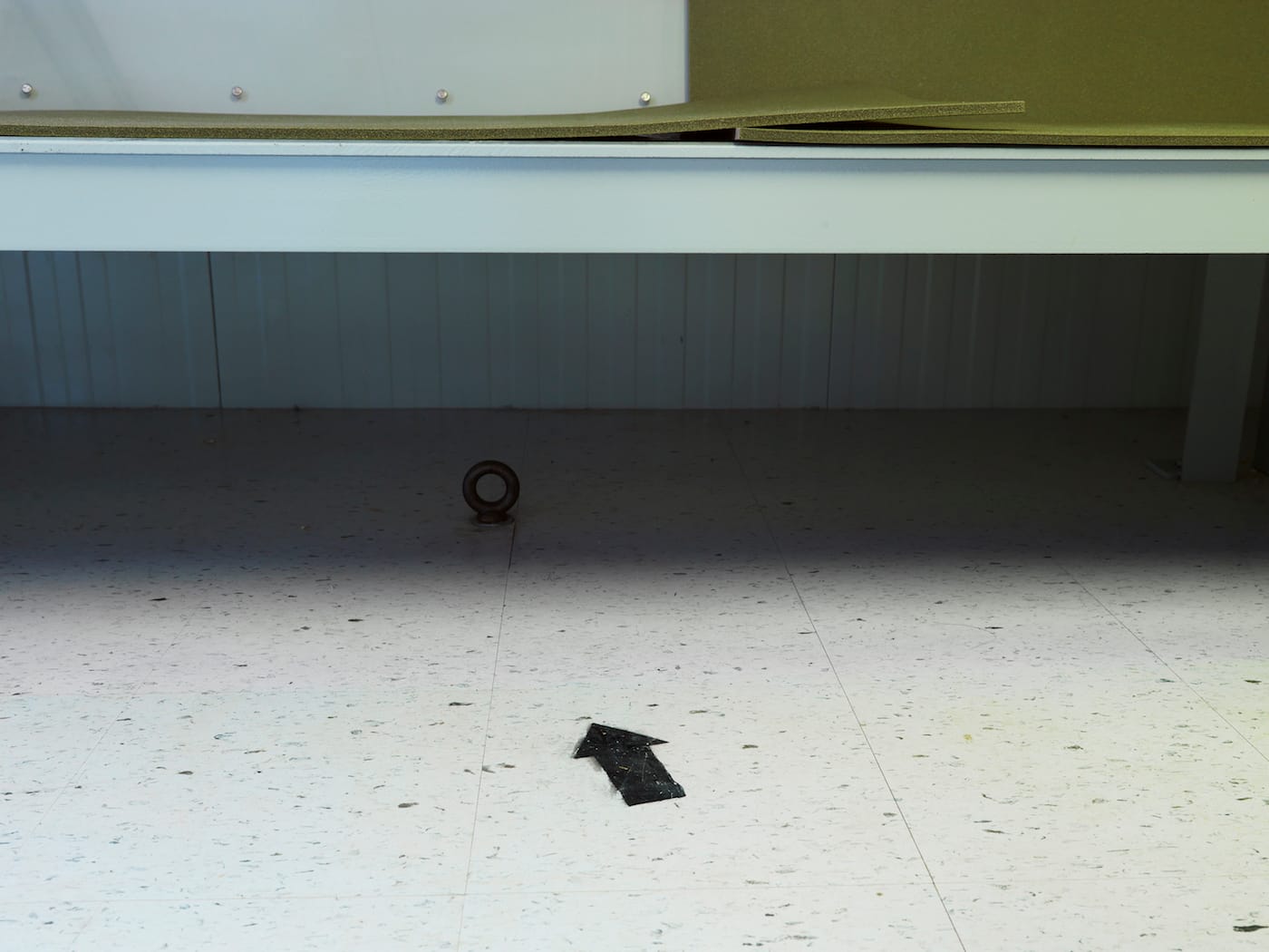 Edmund Clark, "Camp 4, arrow to Mecca and ring for ankle shackles," from the series Guantanamo: If the Light Goes Out (2009) (© Edmund Clark)