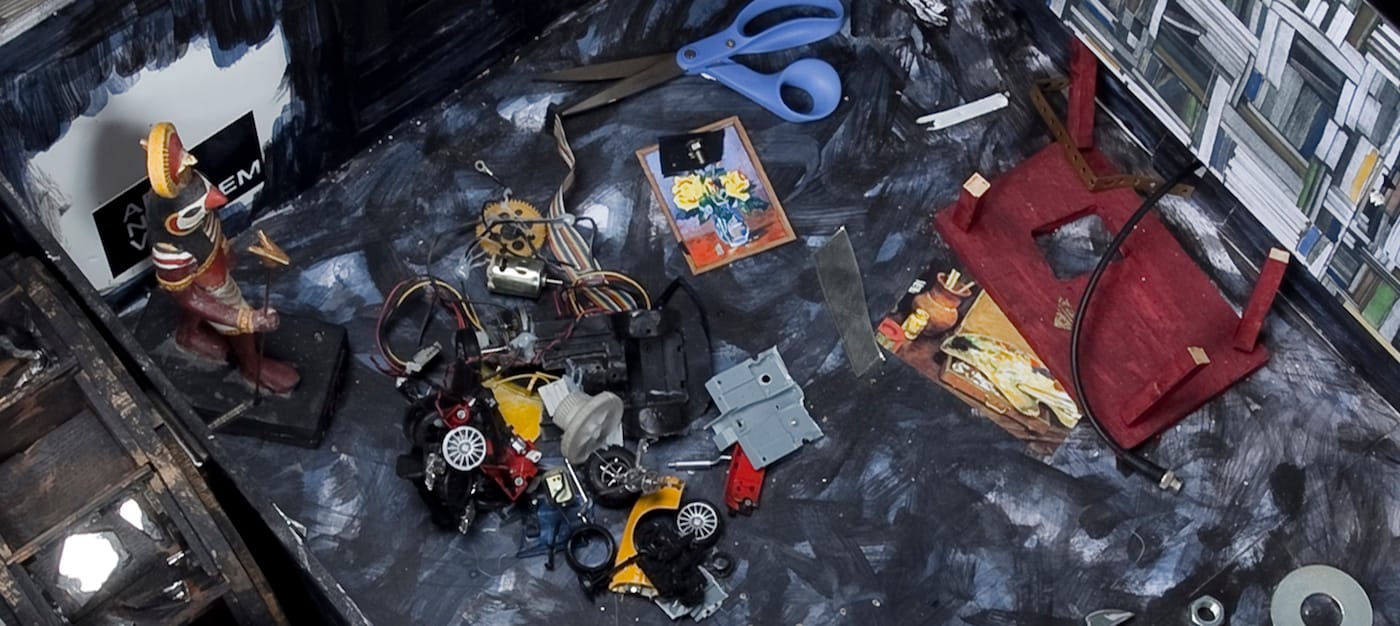 Jean-Luc Godard, "The Camera (metaphor)" (2004–06, detail), foamcore, watercolor, motorized mechanisms, paper collage, Plexiglass, felt pen, lamp, mirrored glass, wood, glue, wrench, various metal screws, nuts, washers, bolts, and mixed media, Rainbow Transvideo monitor, two MP3 iPod video players, 15 1/8 x 41 x 37 3/4 in (courtesy of Miguel Abreu Gallery)