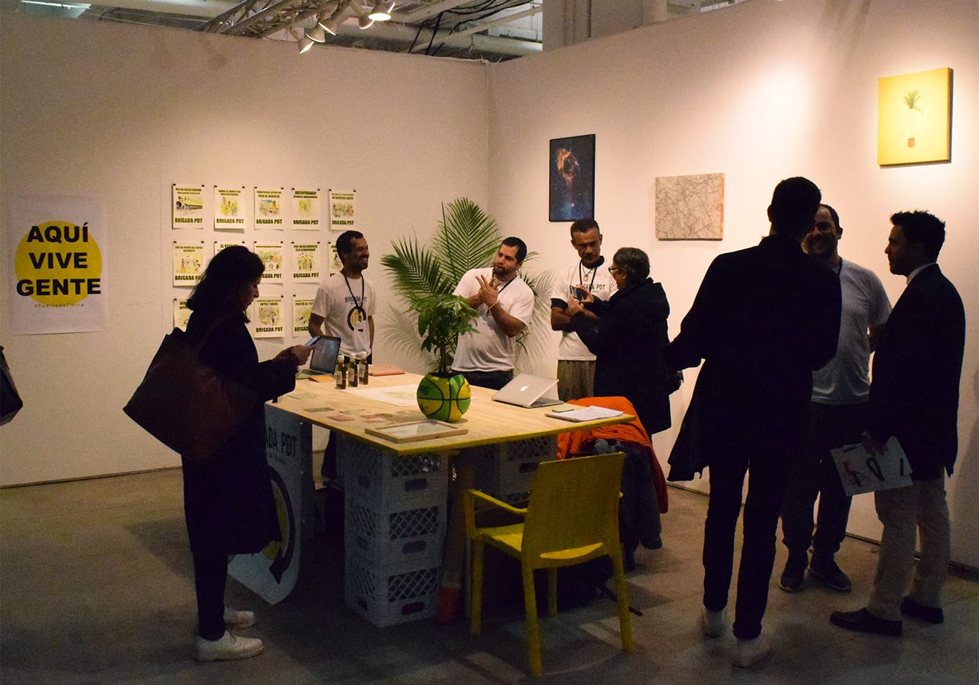Proyectos Ultravioleta's booth is hosting a fundraising show for Brigada Puerta de Tierra, an artist collective in San Juan, Puerto Rico that is raising funds to develop a community health center rooted in herbalism.