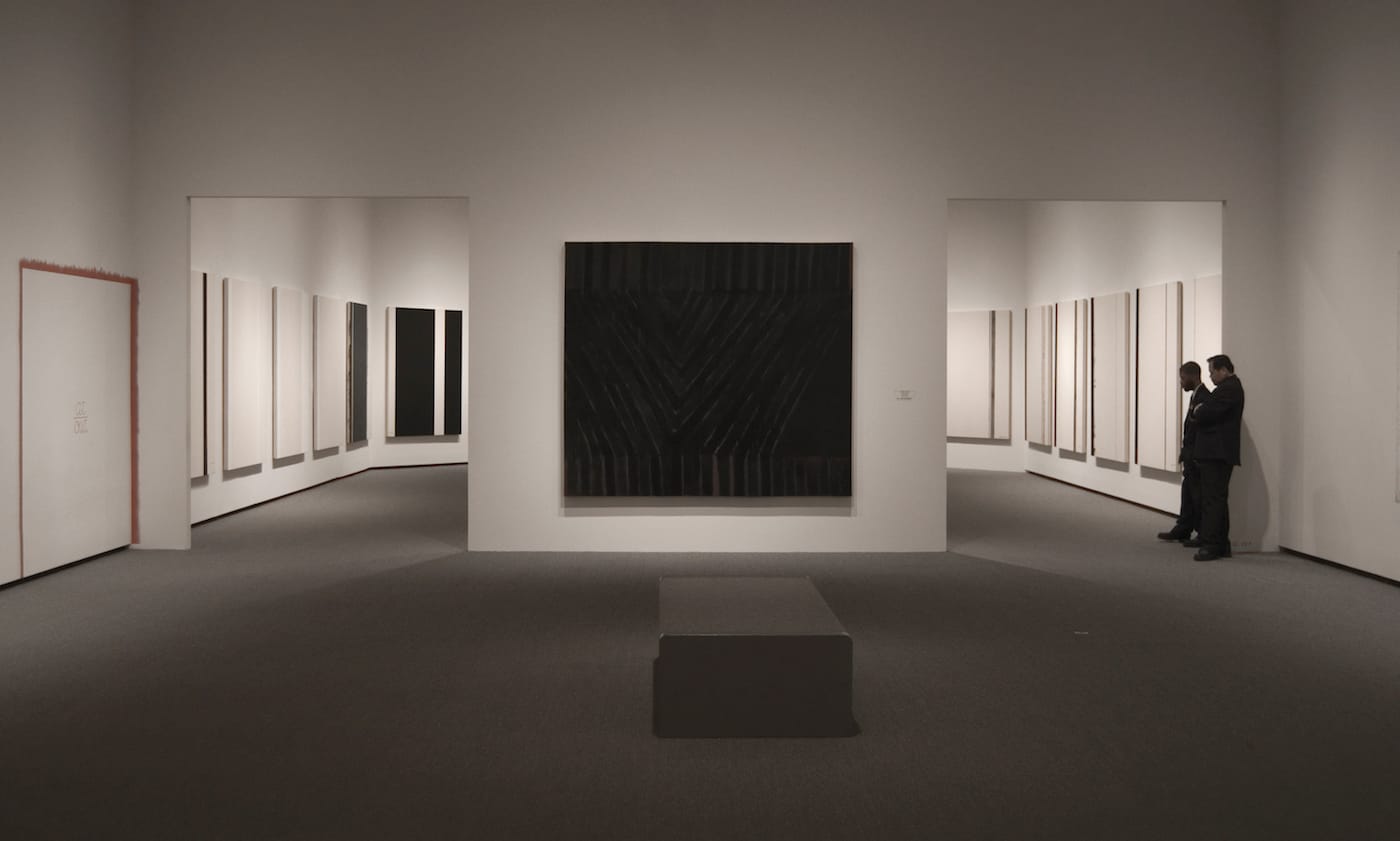 Guards in a gallery in the East Building of the National Gallery of Art in Washington, DC (photo by Lipton sale, via Wikimedia Commons)