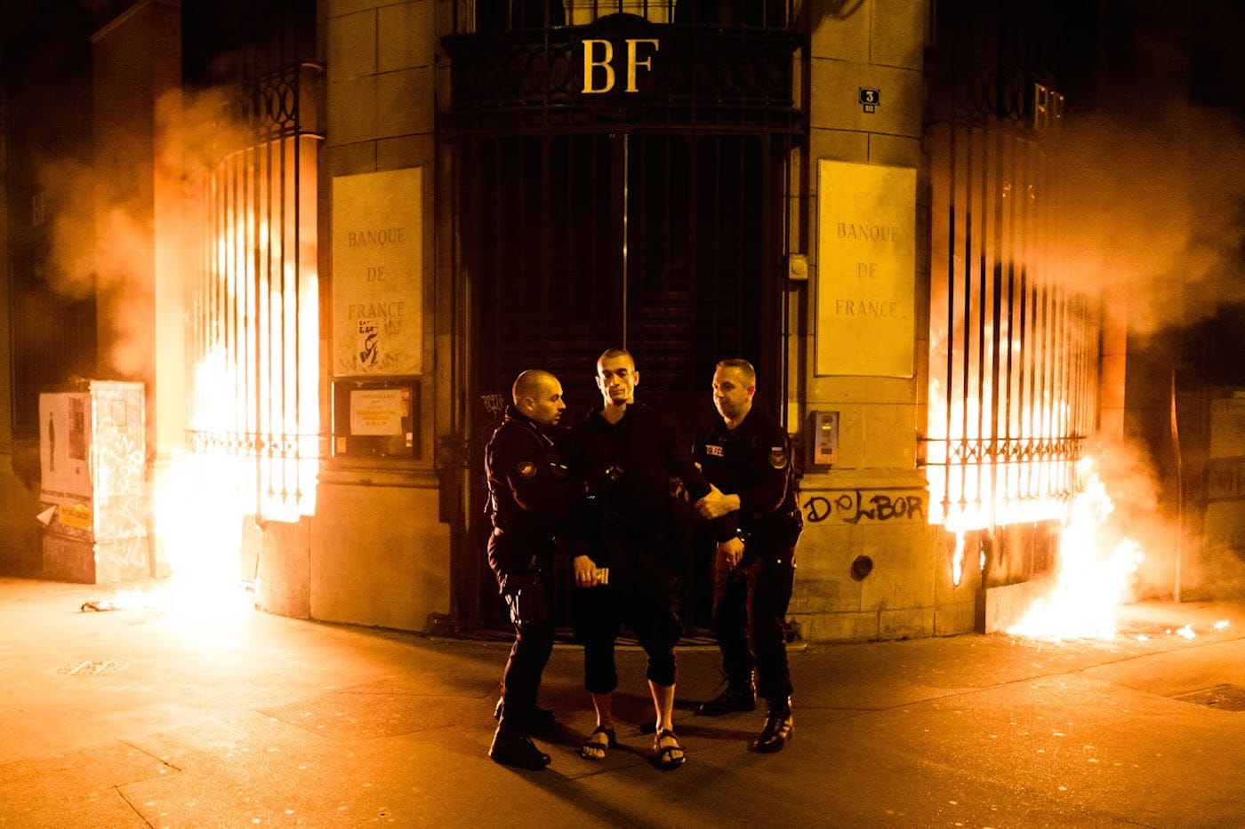 Petr Pavlensky being detained at the scene of his piece, "Lighting," in Paris. (all photos courtesy the artist and Oksana Shaligyna)