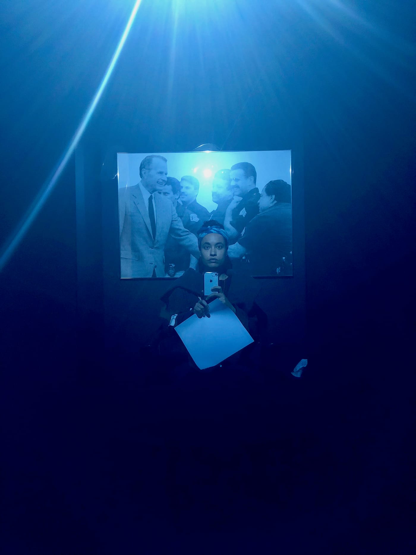 Photo of the author at Adrian Piper: A Synthesis of Intuitions, 1965–2016 at the Museum of Modern Art (photo by the author for Hyperallergic)