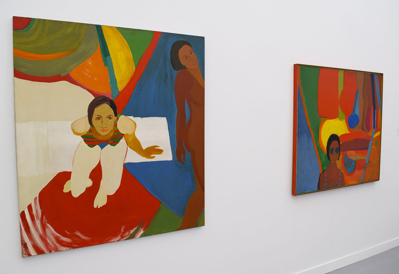 Paintings by Emma Amos, "Seated Figure and Nude" (1966, left) and "Baby" (1966, right), in the Ryan Lee Gallery booth at Frieze New York