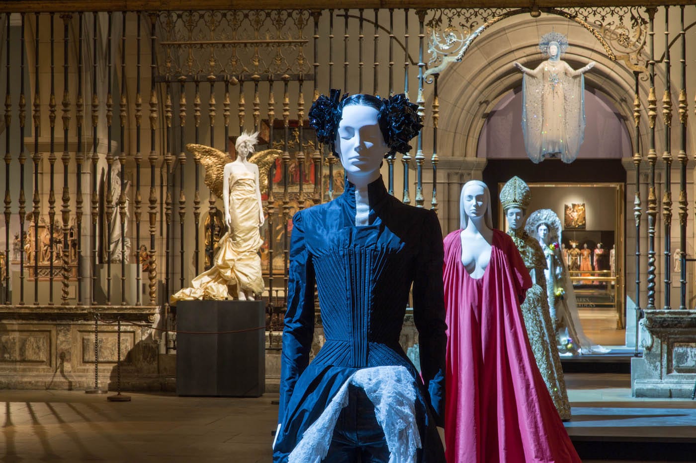 Installation view of <em/>Heavenly Bodies: Fashion and the Catholic Imagination in the Medieval Sculpture Hall (all photos © the Metropolitan Museum of Art unless indicated otherwise)