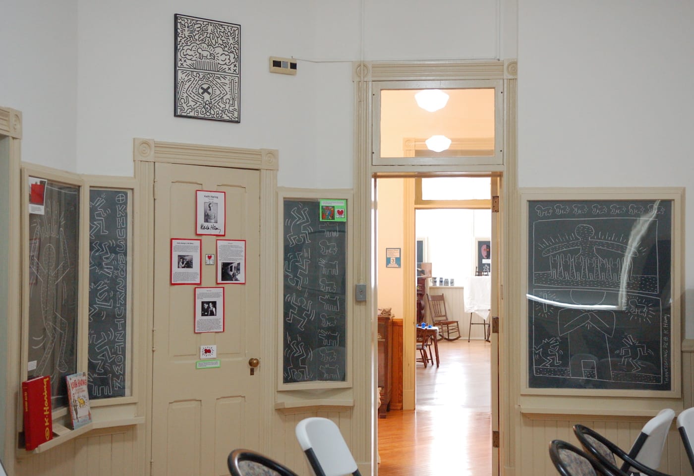 "Untitled" (1982), a suite of chalkboard murals by Keith Haring and, above, his "Poster for Nuclear Disarmament" (1982), inside the Kutztown Area Historical Society