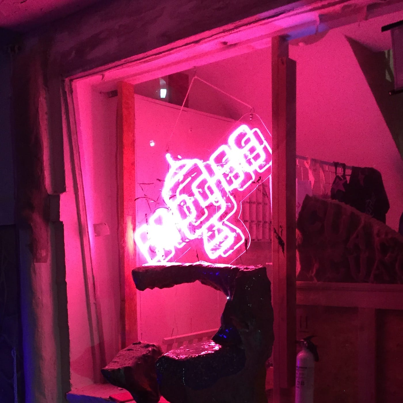 A neon sign of the Satellite Art Show logo at the 2017 edition of the fair