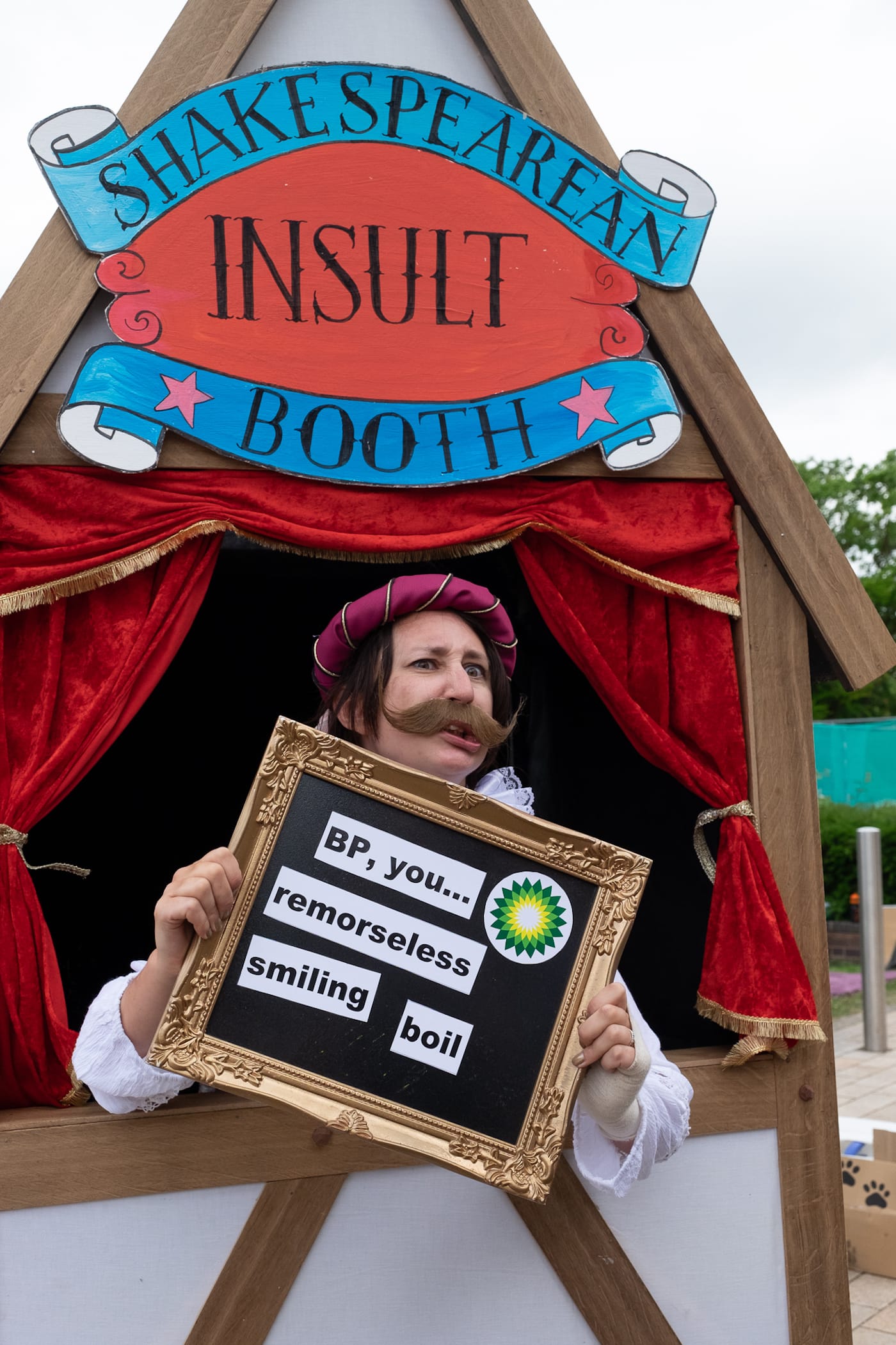 A visitor inside the Shakespearean Insult Booth (photo by Ron Fassbender)