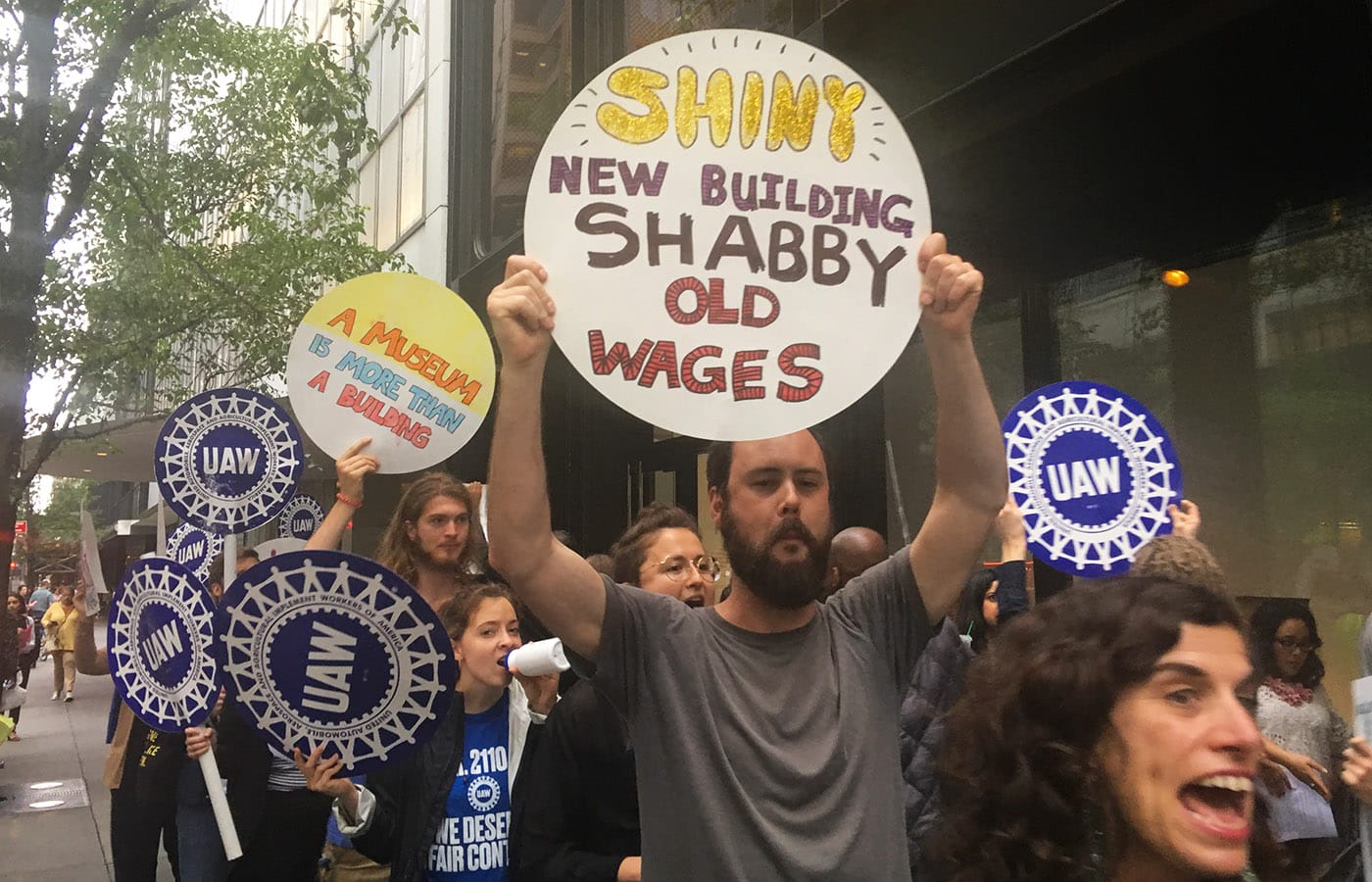 Demonstrators outside the Museum of Modern Art on May 31, 2018, calling for a fair contract for the museum's union workers. (all photos by the author for Hyperallergic)