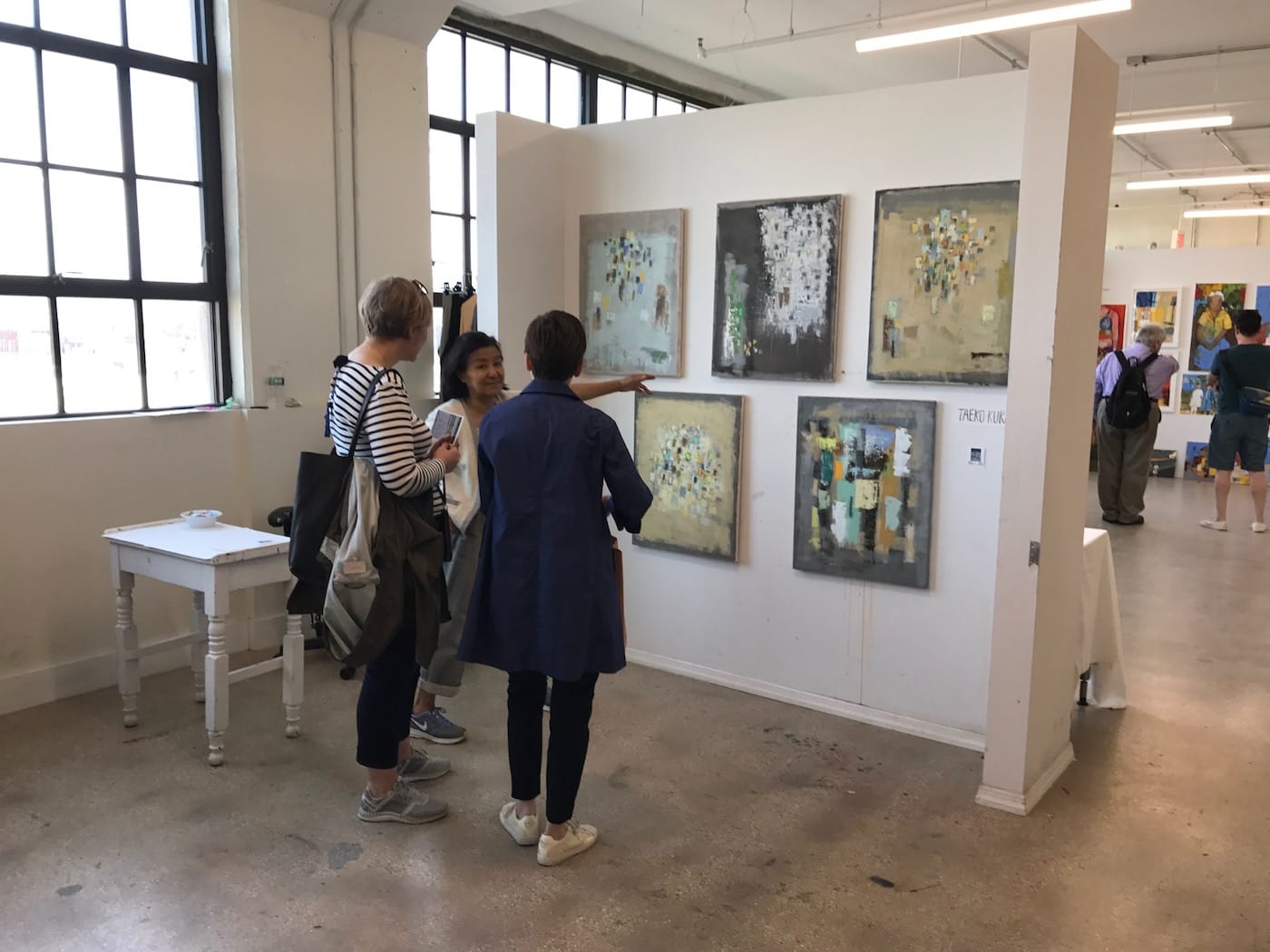 Artist Taeko Kuraya speaks to visitors in her studio (all images courtesy Trestle)
