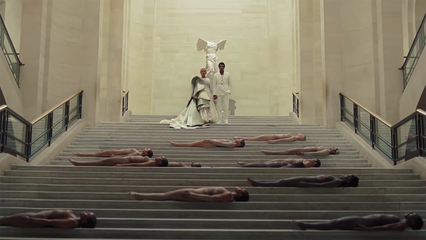 Beyoncé, Jay-Z, and dancers in front of the Winged Victory of Samothrace