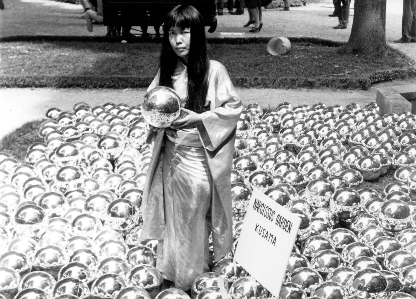 Yayoi Kusama with "Narcissus Garden" (1966) installed in Venice Biennale, Italy, 1966 (©YAYOI KUSAMA, courtesy David Zwirner, New York; Ota Fine Arts, Tokyo/Singapore/Shanghai; Victoria Miro, London/Venice)