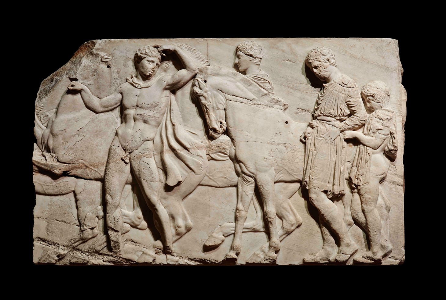 Unmounted youths preparing for the cavalcade, block from the north frieze of the Parthenon, about 438–432 BCE, marble, © The Trustees of the British Museum