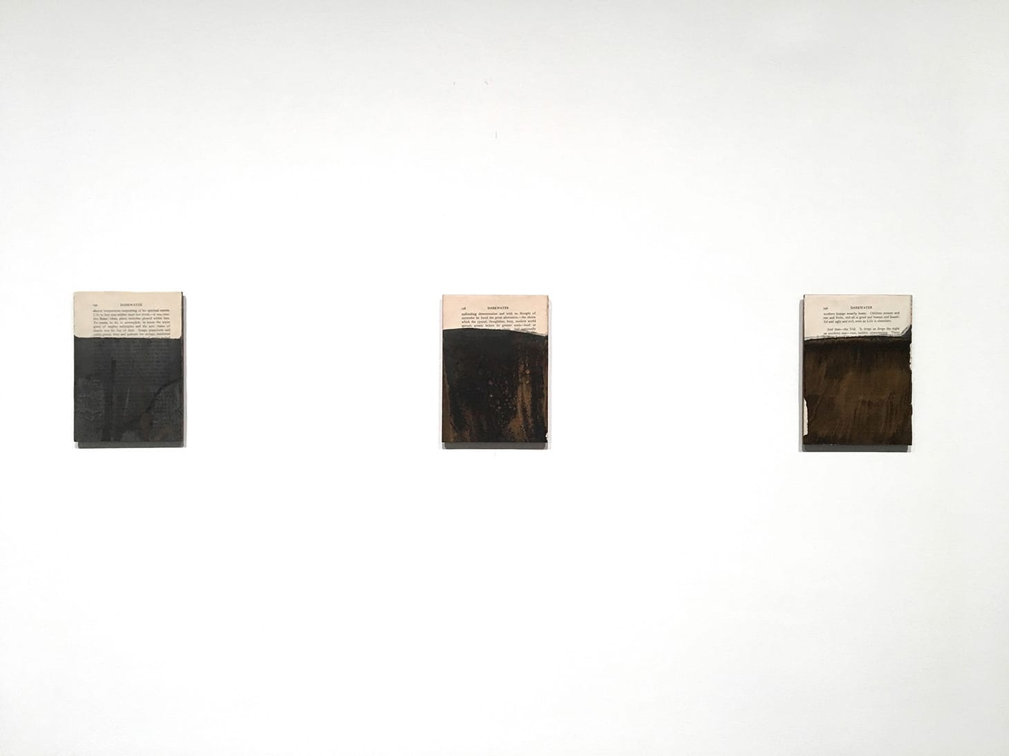 Tim Rollins & K.O.S., “Darkwater” (after W.E.B. Dubois) (2016), Furnace black watercolor, gold acrylic, and book page on panels, Bronx Museum Permanent Collection