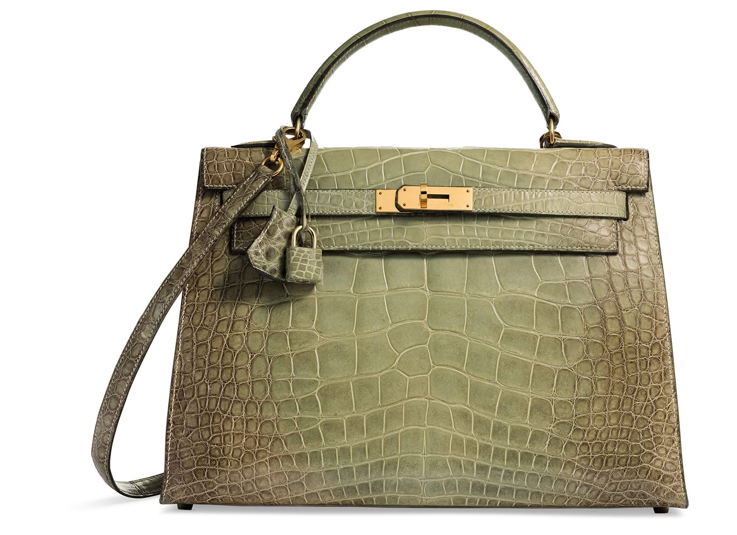 A rare, shiny natura vert céladon alligator Sellier Kelly 32 with gold hardware Hermès (1995), 32 w x 23 h x 11 d centimeters, includes lock, keys, clochette, shoulder strap, dustbag, and box (image courtesy Christie's)