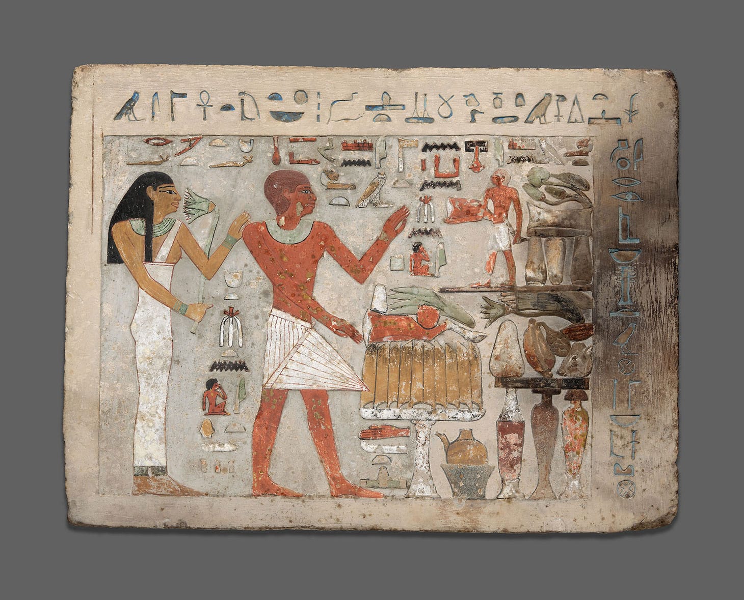 Ancient Egyptian, "Stela (Commemorative Stone) of Amenemhat and Hemet" (1956 BCE–1877 BCE), limestone and pigment, 12 1/4 × 16 3/8 × 2 5/8 inches (image courtesy Museum Purchase Fund)