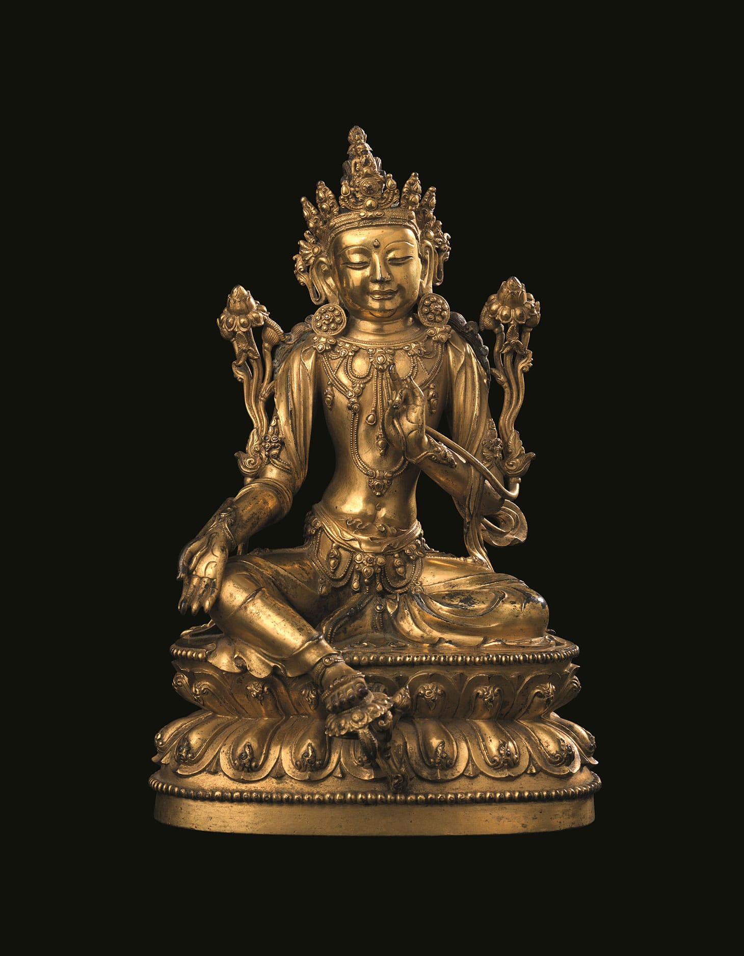 A rare and finely-cast gilt-bronze seated figure of Avalokiteshvara Xuande six-character incised mark and of the period (1426–1435)