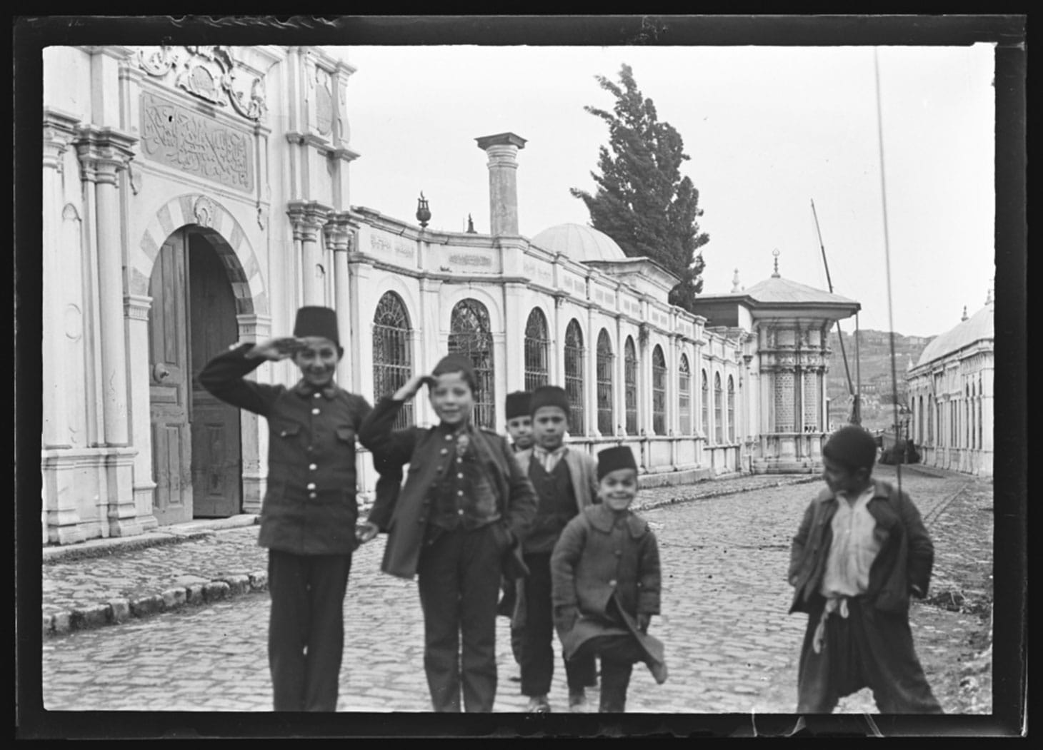 Boys standing in the street (c. 1900), glass plate negative