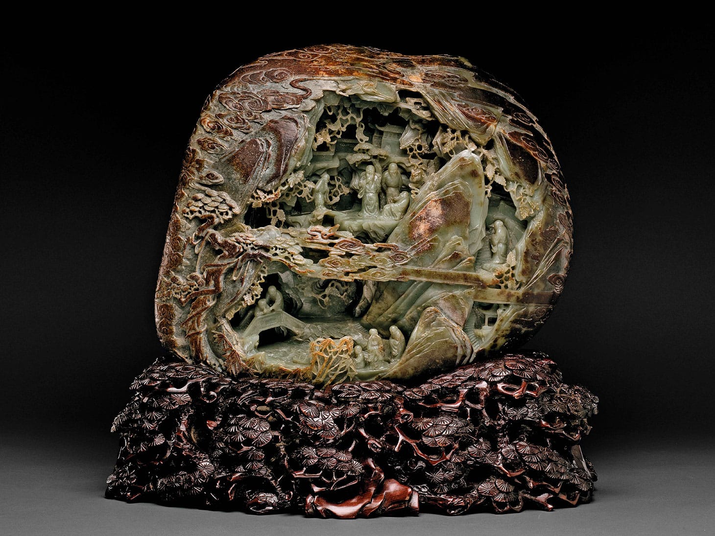 "Jade Mountain," China, Qing dynasty (1644–1911), 18th century Nephrite, carved wood base 14 × 17 × 4.5 inches (image courtesy Crow Museum of Asian Art)